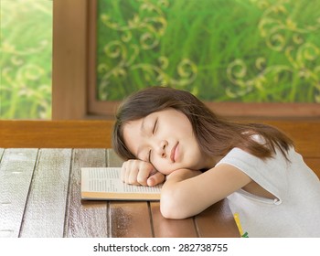 Asian Girl Sleeping While Sitting At Desk,Sleeping While Learning