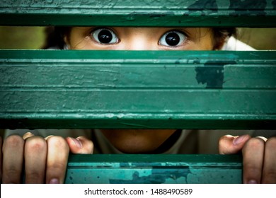 Asian Girl Sneak Peek,peeping Spying Eyes,suspiciously Child Feel Afraid Fear,frightened Or Saw Something Scary With Fixed Eyes,shock Or Terrified,female Psychiatric Patient,mental Disorder,mistrust  