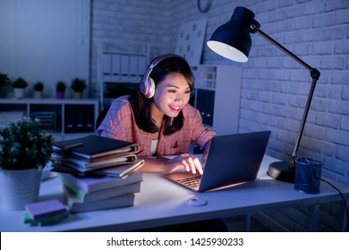 Asian Girl Student Use The Laptop In The Evening