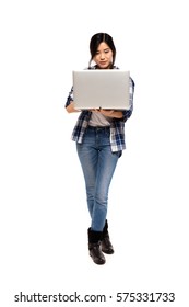 Asian Girl Using A Laptop Isolated On White Background