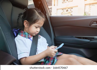 Asian Girl Using Smart Phone With Proper Safety Belt.