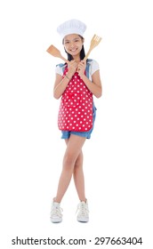 Asian Girl Wearing Apron And Holding Cooking Utensil