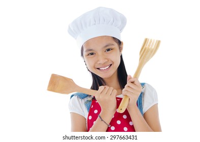 Asian Girl Wearing Apron And Holding Cooking Utensils