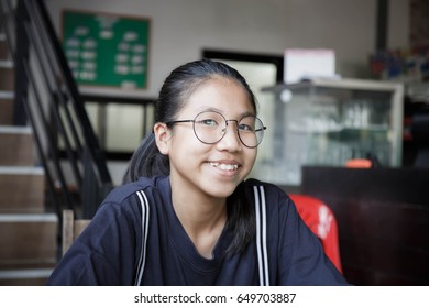 Asian girl wearing glasses is smiling - Shutterstock ID 649703887
