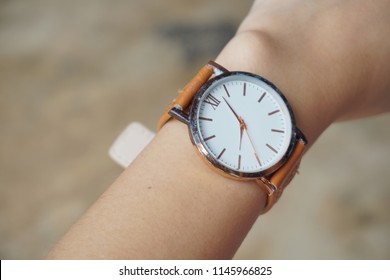 Asian Girl Is Wearing Hand Watch.