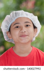 Asian Girl Wearing Shower Cap And Shows Funny Face