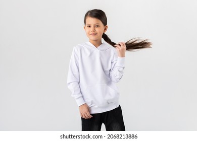 Asian Girl In A White Hoodie. Kids Hoodies Mockup.