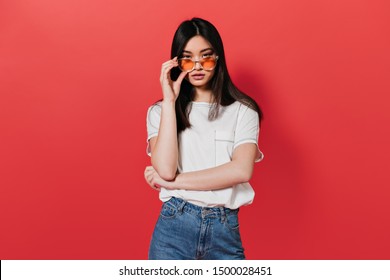 Asian Girl In White T-shirt Takes Off Her Sunglasses