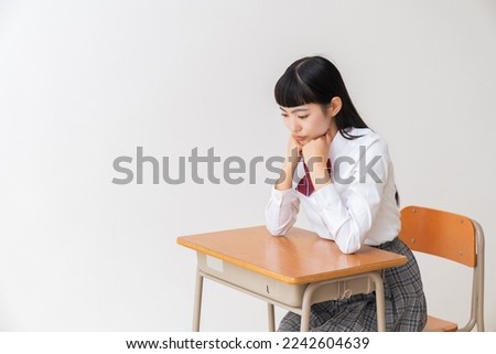 asian girl who study,think,School uniform,School classroom