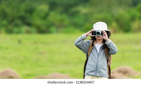 Asian Girl Woman Take A Photo And Checking Camera. People Tourism Travel Destination Leisure Trips For Education Relax Outdoors Adventure Forest Nature. Travel Vacations Concept