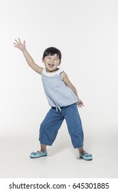 An Asian Girl(kid) Dancing With Smile Isolated White.