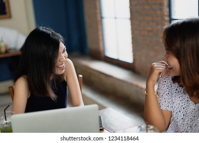 Asian girls freelance meeting with colleague at the coffeeshop. - Shutterstock ID 1234118464