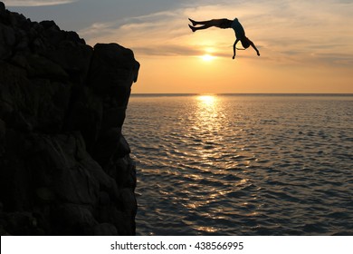 Asian girls jump from a cliff into the sea episode sunset,Somersault to the ocean.