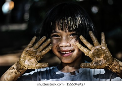 Asian Girls Are Playing In Mud.