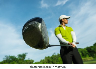 Asian Golfer Preparation To Drive Golf