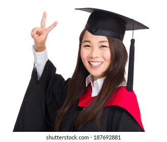 Asian graduate girl with victory sign