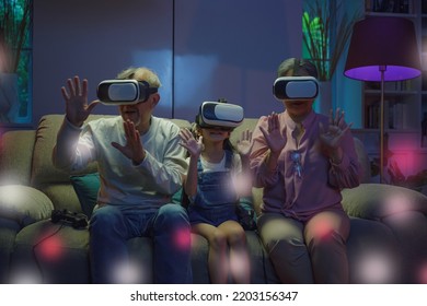 Asian granddaughter and grandparents playing together exciting interesting video games using virtual reality headsets living room at home, elderly with child play VR video game, family entertainment - Powered by Shutterstock