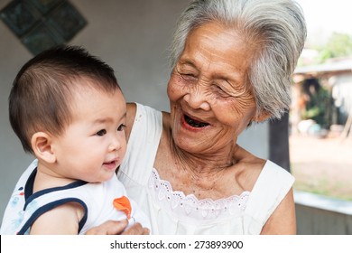 Asian Grandmother With Baby