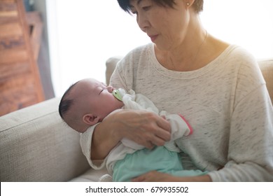 Asian Grandmother And Her Grandchild