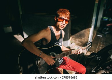 Asian Guitarist Artist Fashion Man Play Guitar On Street