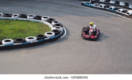 Asian Guy Enjoying Go Kart Racing.