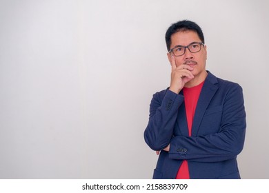 Asian Guy Standing Alone With Such A Confused Facial Expression