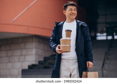 Asian Guy With Take Away Food Boxes