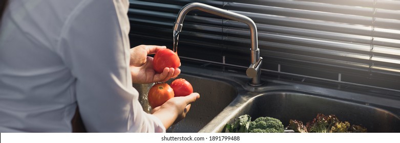 Asian Hands Woman Washing Vegetables Tomato And Preparation Healthy Food In Kitchen.