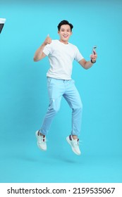 Asian Handsome And Cheerful Young Man, Isolated On Background