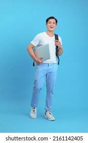 Asian Handsome And Cheerful Young Student Man, Isolated On Background