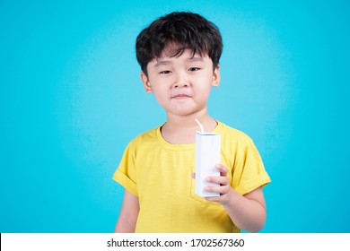 Asian Handsome Cute Little Boy Kid With Lovely Expression And Hold Milk Carton Box