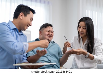 Asian Happy Family Draw Picture With Young Son In Living Room At Home. Beautiful Loving Mother And Father Take Care And Teach Young Man Patient To Painting Artwork Indoors At House. Lifestyle Activity