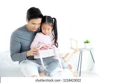 Asian Happy Father's Day Concept, The Daughter Is Giving Gifts To Her Father.