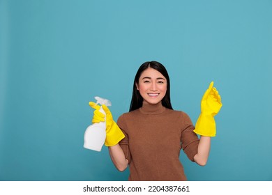 Asian Happy Glad Housewife From Daily Work Holding Spray In Yellow Rubber Glove, Cleaning Home Concept, Cheerful Satisfied Woman With Positive Mindset From Day To Day Chores