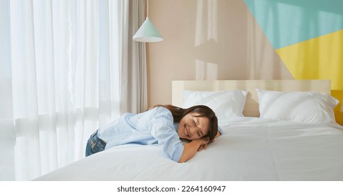 asian happy woman changes bed quilt in bedroom and it is fresh and comfortable - Shutterstock ID 2264160947