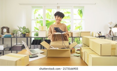 An Asian Happy Woman Girl Working Online From Home, Selling Product, In Technology Social Media. Online Shopping Business. SME Ecommerce. People Lifestyle.