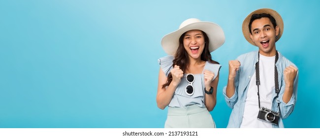 Asian Happy Young Couple Tourist Preparing For Travel With Copy Space Isolated On Blue Banner Background.