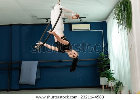 Asian healty sport female slim fit sportware yoga work out exercise Aerial Hoop indoor studio yoga 