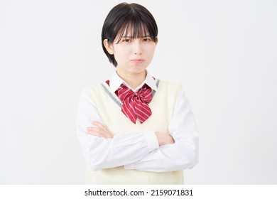 Asian High School Student Being Angry In White Background