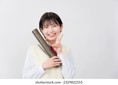 Asian high school student with the diploma in a tube peace sign gesture in white background