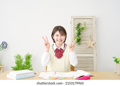 Asian High School Student Peace Sign Gesture