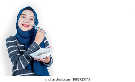 Asian Hijab Woman Spa Mask Half-face Beauty Concept Healthy Portrait. Isolated On White Background. Free Space For Text