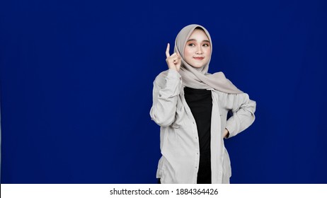 Asian Hijab Woman Thingking And Get Idea Isolated Blue Background