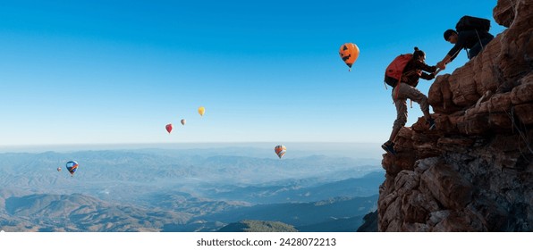 Asian hiking help each other on the top of mountain. teamwork concept - Powered by Shutterstock