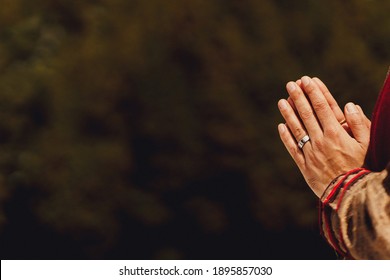 Asian Hindu Priest Praying At A Wedding. Holding His Hands Together.