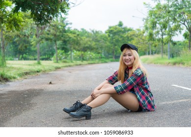 Asian hipsters girl posing for take a photo on the road,lifestyle of modern woman,Thai people in hippie style