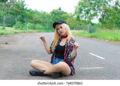 Asian hipsters girl posing for take a photo on the road,lifestyle of modern woman,Thai people in hippie style
