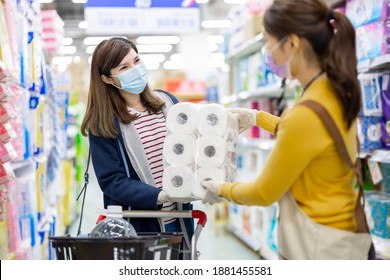 Asian Homemaker Wearing Face Mask And Gloves Is Talking To Paper Towels Sales At Grocery Store During Coronavirus And Flu Outbreak