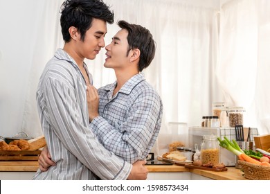 Asian Homosexual Couple Hug And Kiss At Kitchen In The Morning.Concept LGBT Gay.