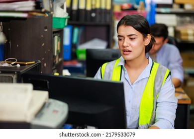 Asian Indian Beautiful Woman Warehouse Worker Checking Order  In Desktop Computer At Office Warehouse Factory. Check Emails.